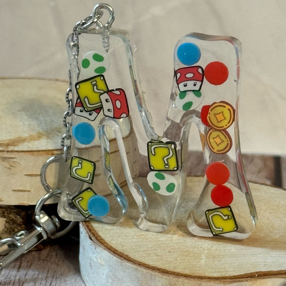Letter M with video game inspired charms newly made.